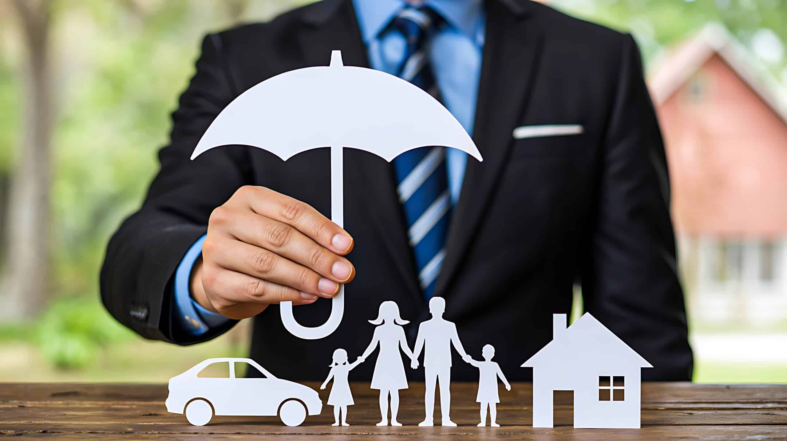 Businessman holding umbrella protecting family car and house icons representing insurance concept